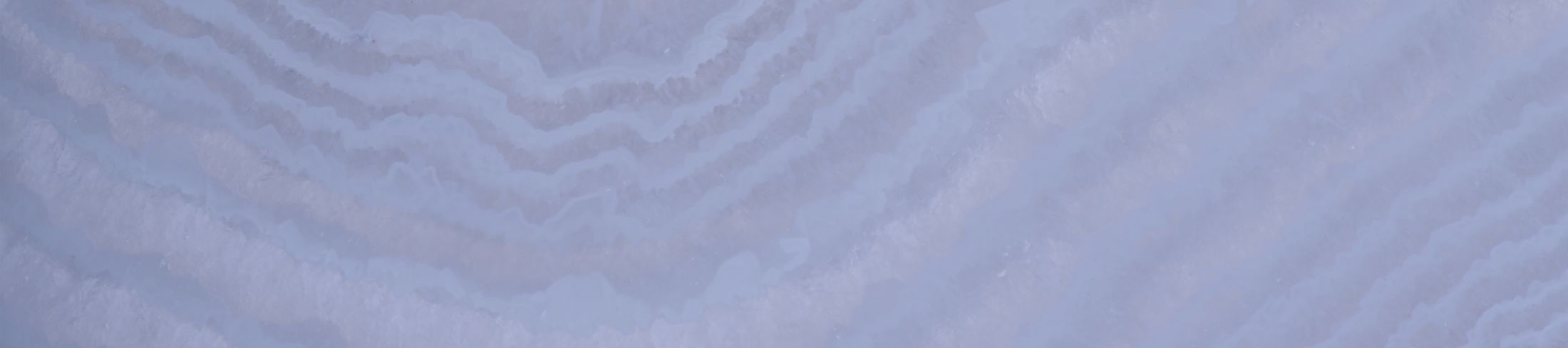 Light blue abstract texture with wavy patterns.