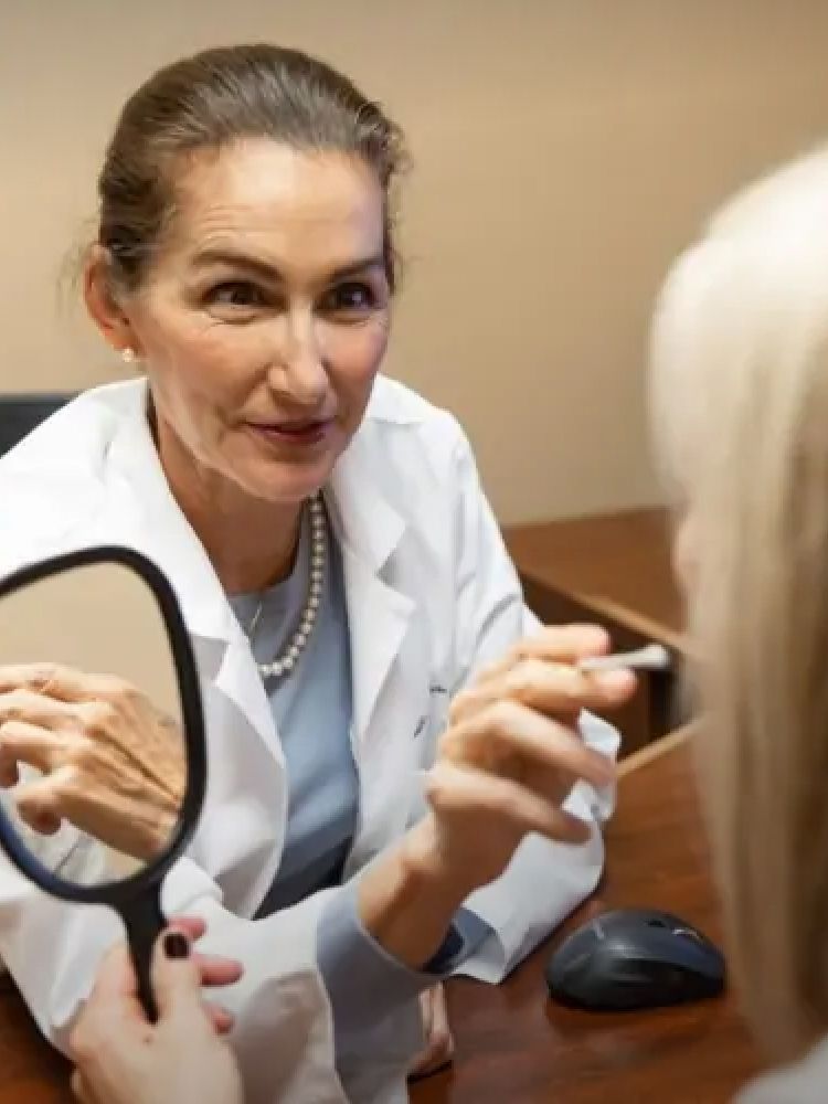 santa rosa plastic surgeon speaking to patient