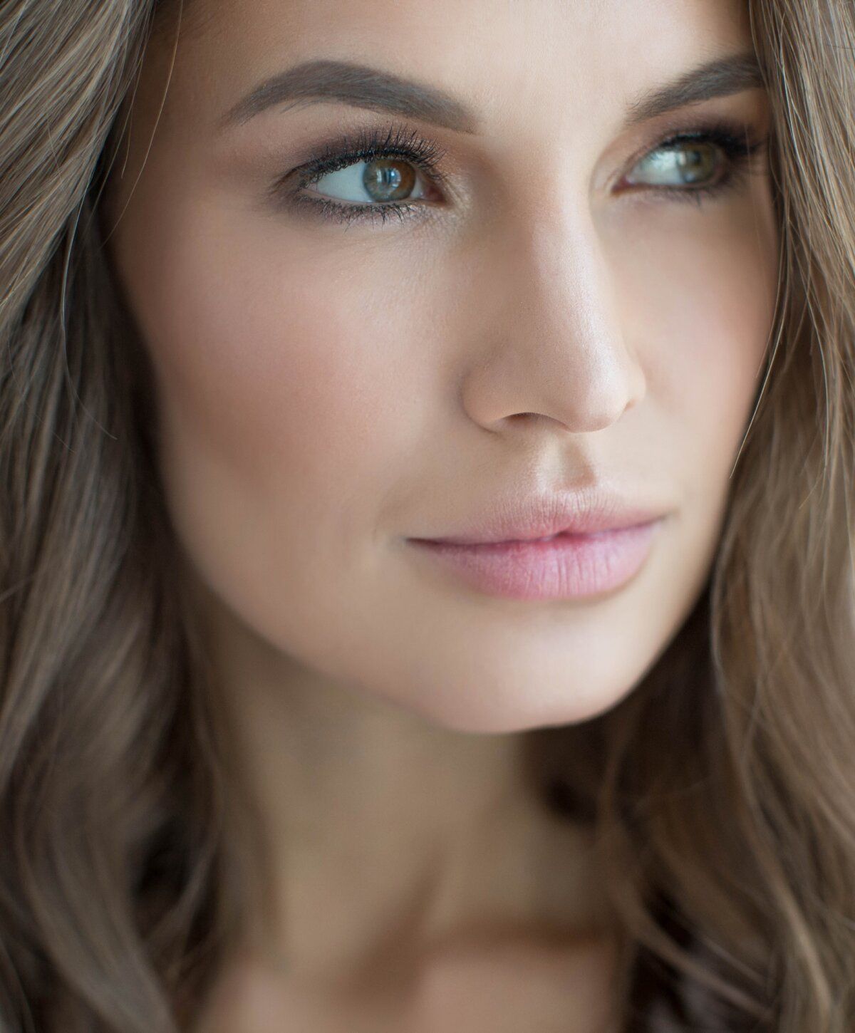 Close-up portrait of a woman with natural beauty.