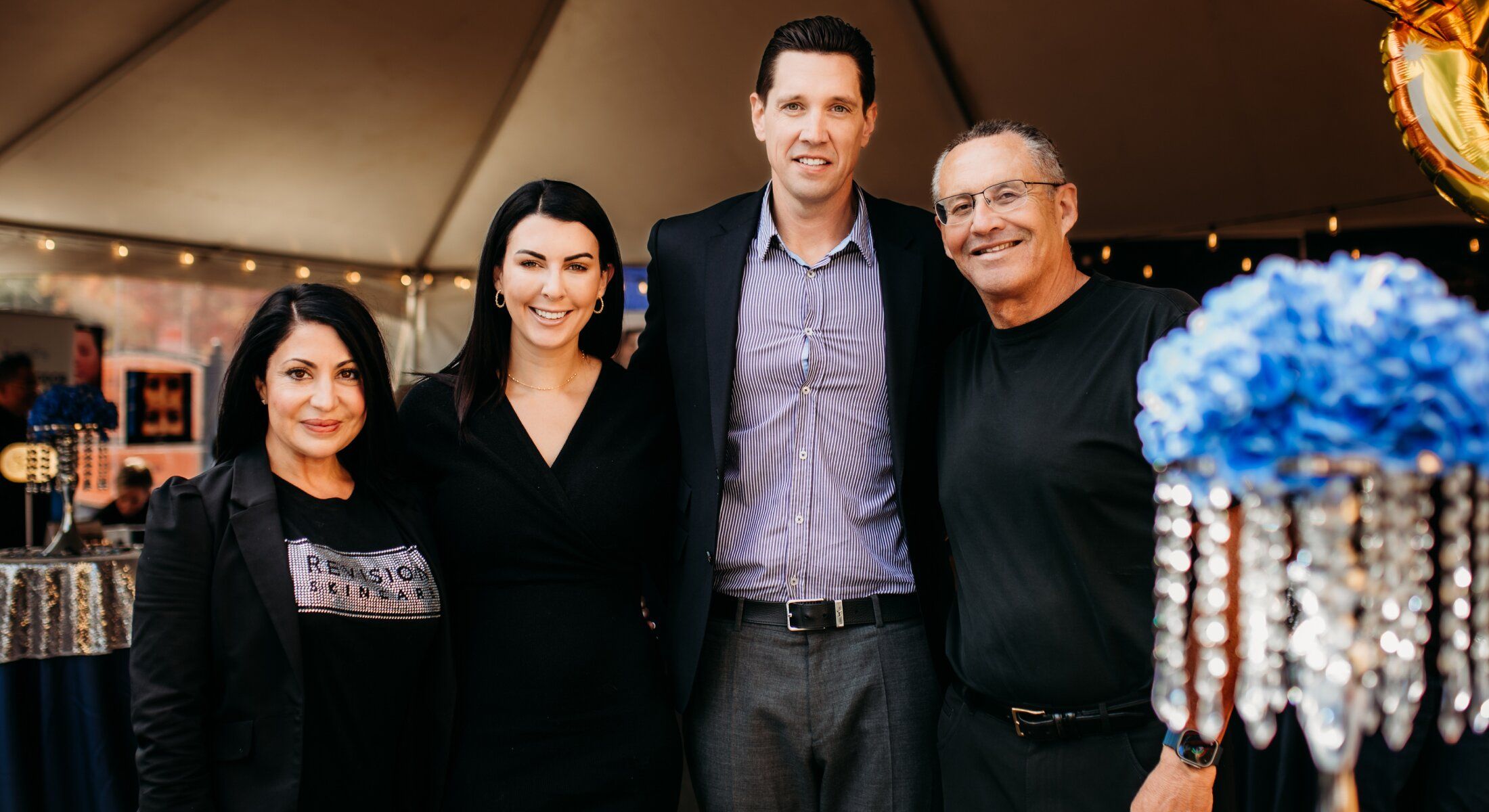 Group photo at a festive outdoor event.